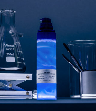 1% Blue Peptide Cica Skin Booster glowing blue between lab flasks and spatulas