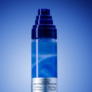 Close-up of 1% Blue Peptide Cica Skin Booster pump bottle with shimmering blue liquid