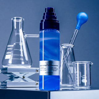 1% Blue Peptide Cica Skin Booster bottle with lab glassware and a blue pipette