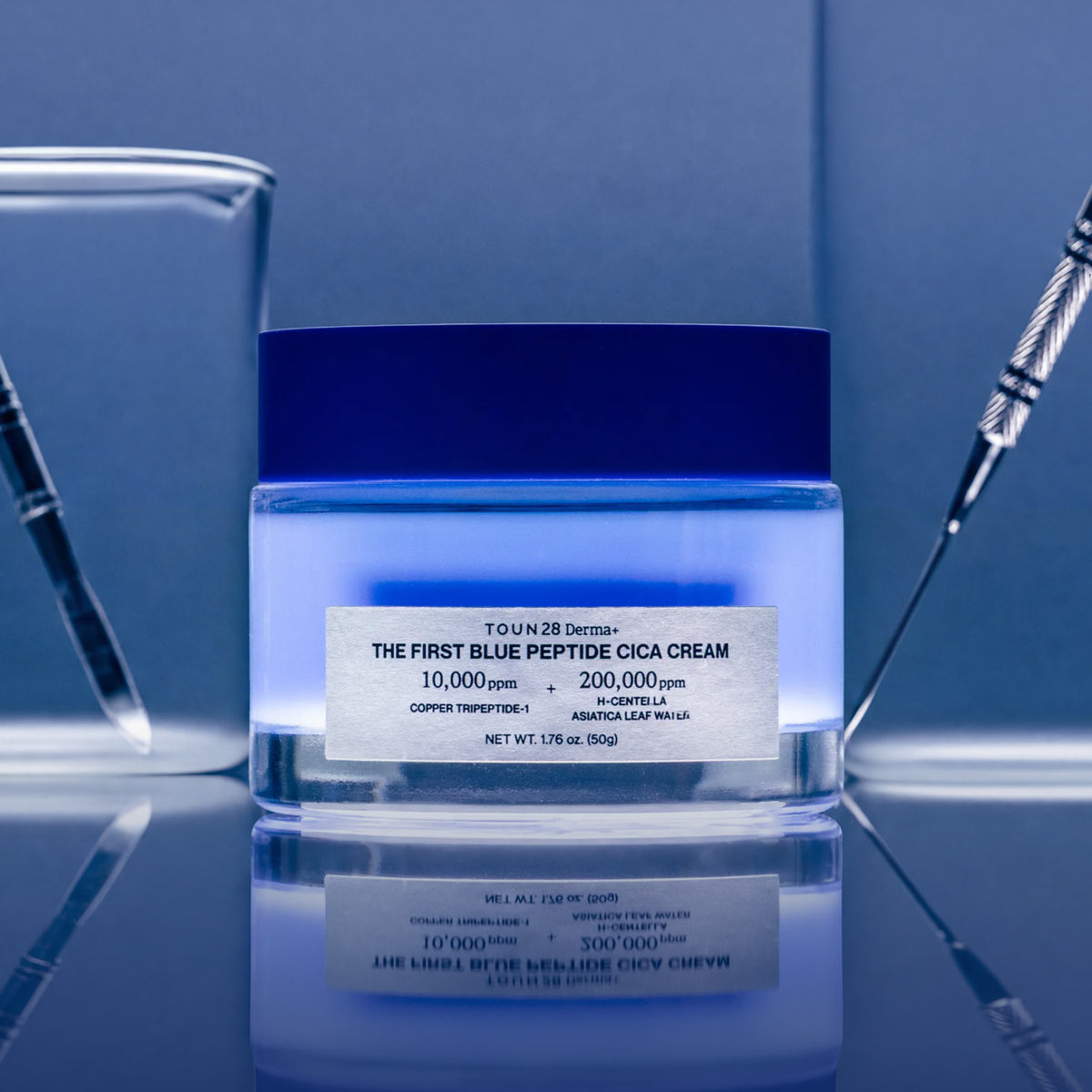 1% Blue Peptide Cica Cream jar in a blue lab setting with glass beakers