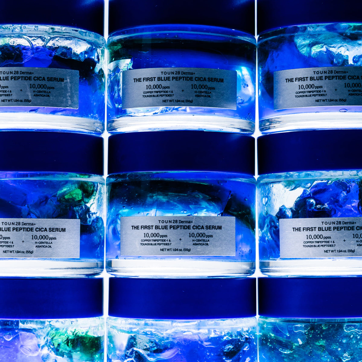 Stacked jars of 1% Blue Peptide Cica Serum showing dual-layer blue and green gel