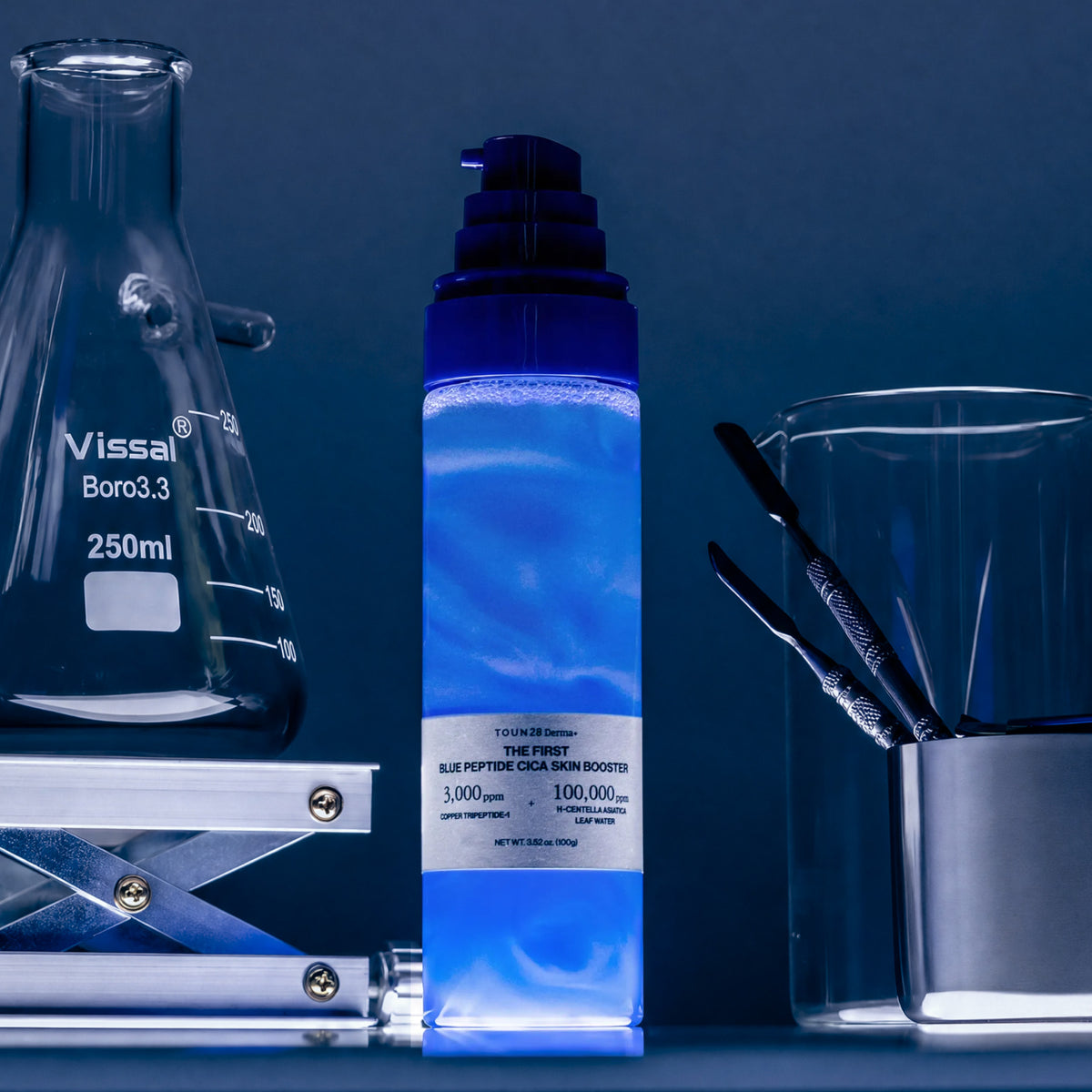 1% Blue Peptide Cica Skin Booster pump bottle with shimmering blue liquid in a lab setting